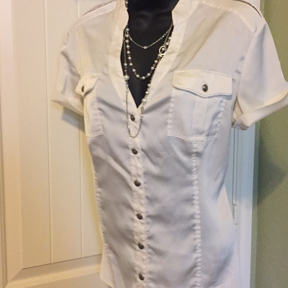 So many details on this cream silk blouse!